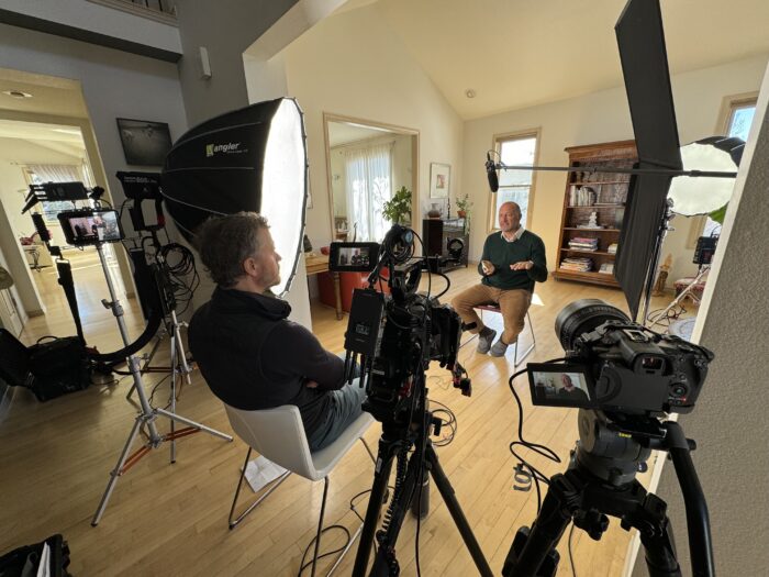 A wide angle of a professional video production company interviewing a subject.