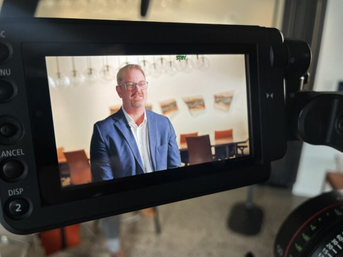 Close-up of a camera screen during a talking-head interview